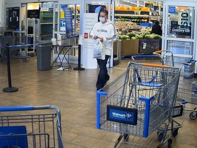 Surveillance footage from the Lakewood Walmart shows the suspect leaving with a bag of groceries bought with a stolen credit card. 