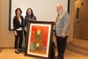 Indian Wells Mayor Ted Mertens, right, helps unveil official 2019 Indian Wells Arts Festival Commemorative Poster       