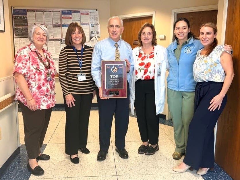 Pictured, left to right, In-Service Coordinator Liz Correa, Asst. Administrator Marie Halis, Executive Director George Zeitler, Director of Nursing Madelyn Cerrato, Asst. Director of Nursing Luisa Clavijo, and Director of Admissions Althea David.