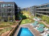 Outdoor space at Harrison Urby includes walkways, lush lawns, and planted areas that include a meandering bluestone path through an Aspen Grove.  There’s also a community garden and a heated swimming pool and patio.