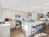 A model residence at Stonehill showcases the community’s modern kitchens, soaring ceilings and spacious layouts. 