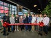 Principals of Advance Realty Investors and Episcope Hospitality join Harrison Mayor James Fife, town officials, and community leaders to cut the ceremonial ribbon celebrating the grand opening of Keepers