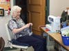 Sr. Mary Landon, FSP adds the finishing touches to a protective mask