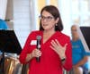Amanda V. Rand, Esq., Principal, President and CEO of Spinnaker Trust, speaks during the firm's 25th anniversary celebration at The Woodlands Club in Falmouth on Sept. 17, 2026.