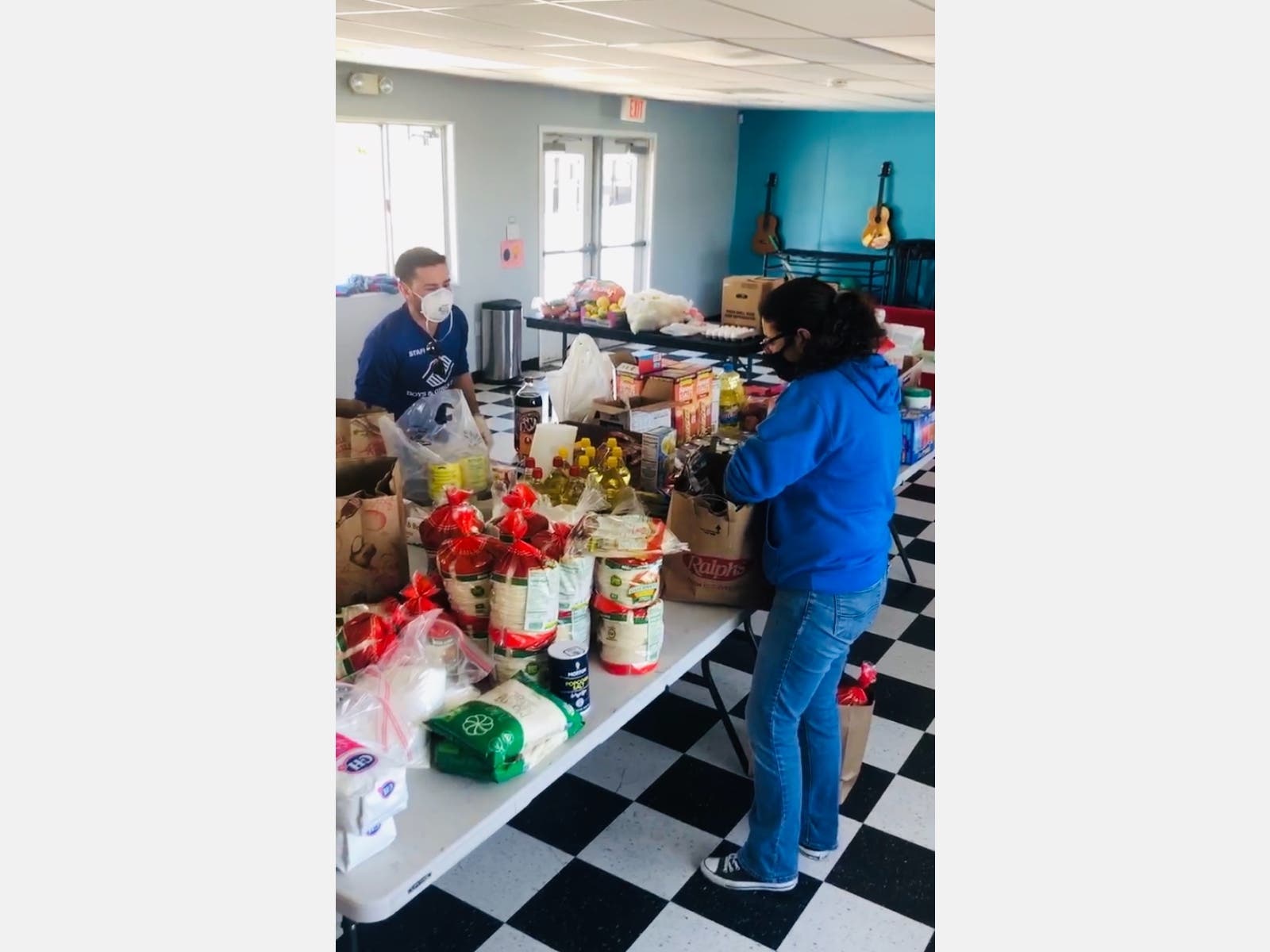 BGCM Celeste Lopez & Sebastian Spiroglou help pack meals to deliver.