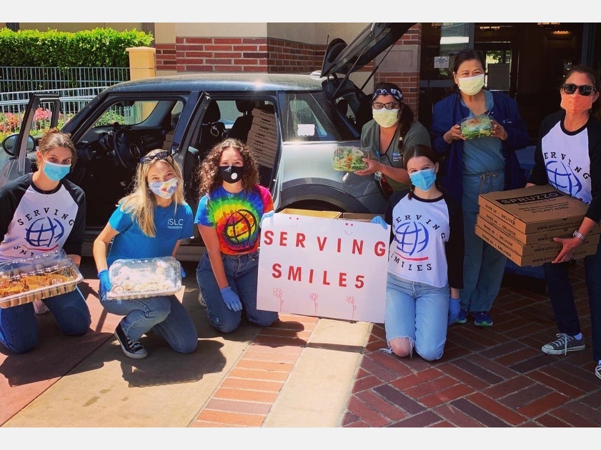 MHS students serve smiles and pizza to ER workers 