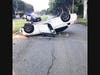 A BMW flips over on Sunset Boulevard.