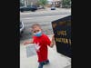Katie Dunn's son carries a handmade poster.