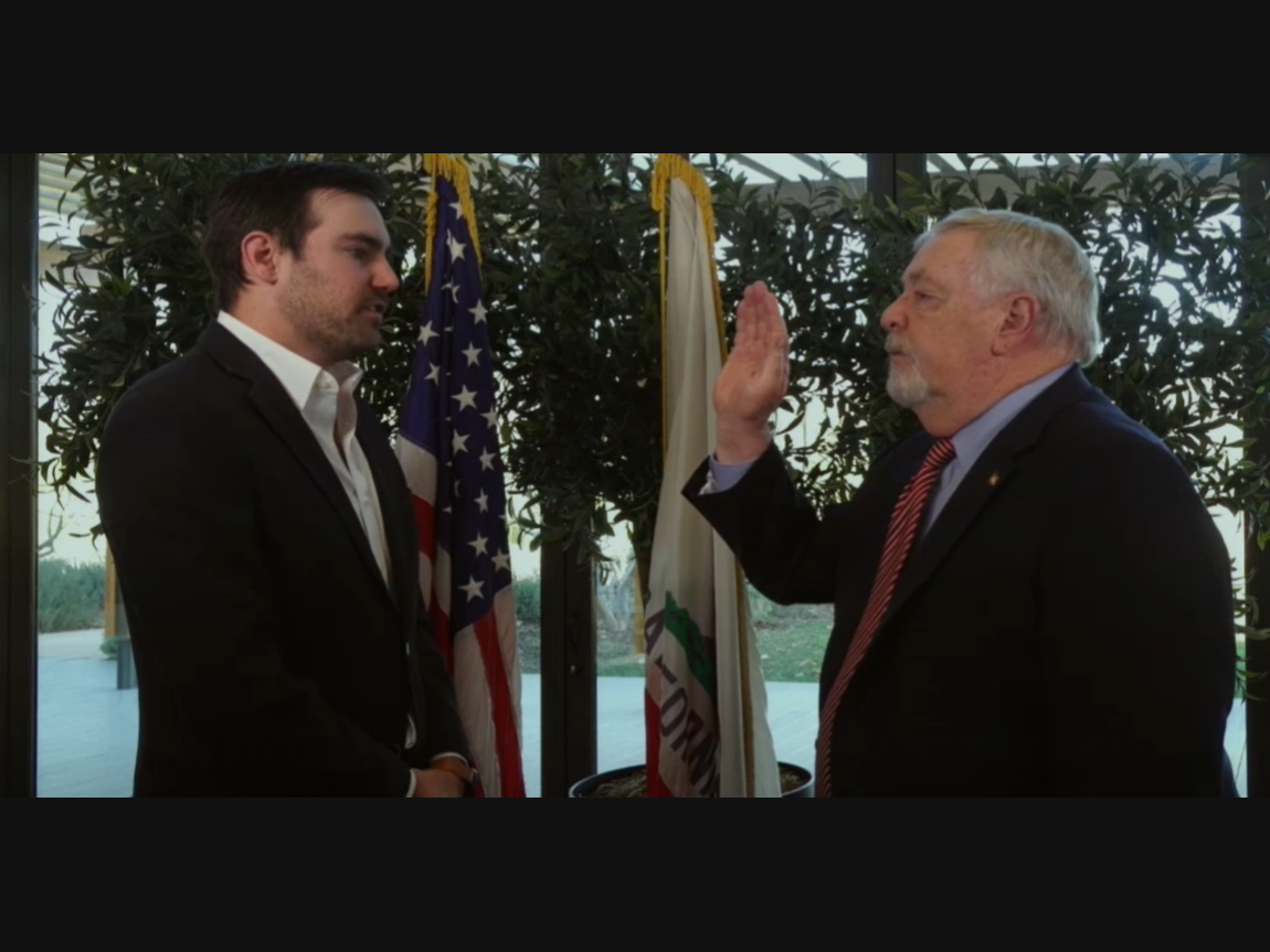 Denis Weber is sworn in by his son Christopher Weber for his 7th term.