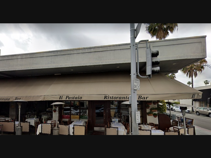 Three suspects demanded property from another patron at the restaurant before opening fire. Two were injured.