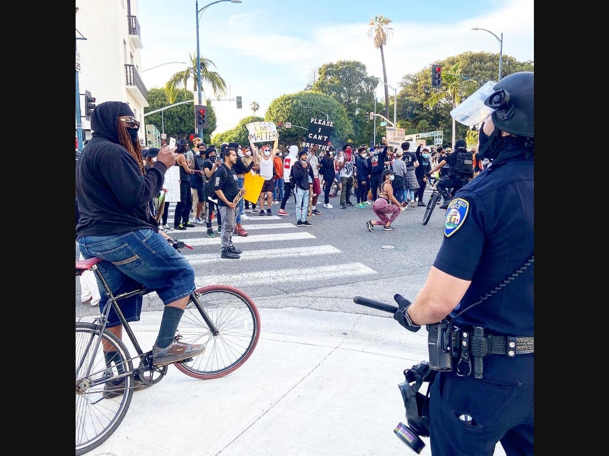 Beverly Hills police face protesters in June. The lawsuit alleges that the city and police violated the protesters’ constitutional and civil rights through curfews, false imprisonment, and intentional infliction of emotional distress.