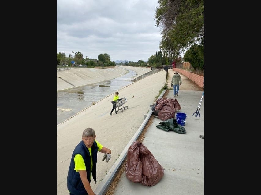Mather and crew clean shopping carts out of the LA River.