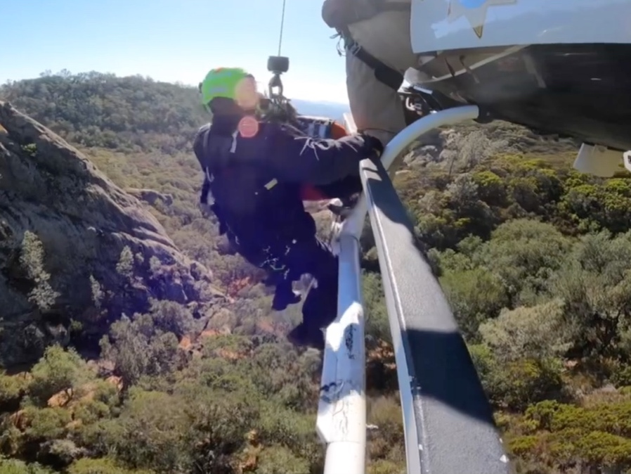 A San Ramon Valley Fire Helicopter Rescue Technician prepares to perform a helicopter rescue. 
