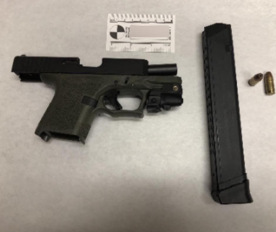 Police recovered a firearm on the waistband of a 17-year-old suspect, who was reportedly on probation for firearm possession.