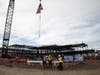 The final beam is placed atop the structure. 