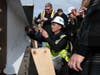 A worker signed the final construction beam.