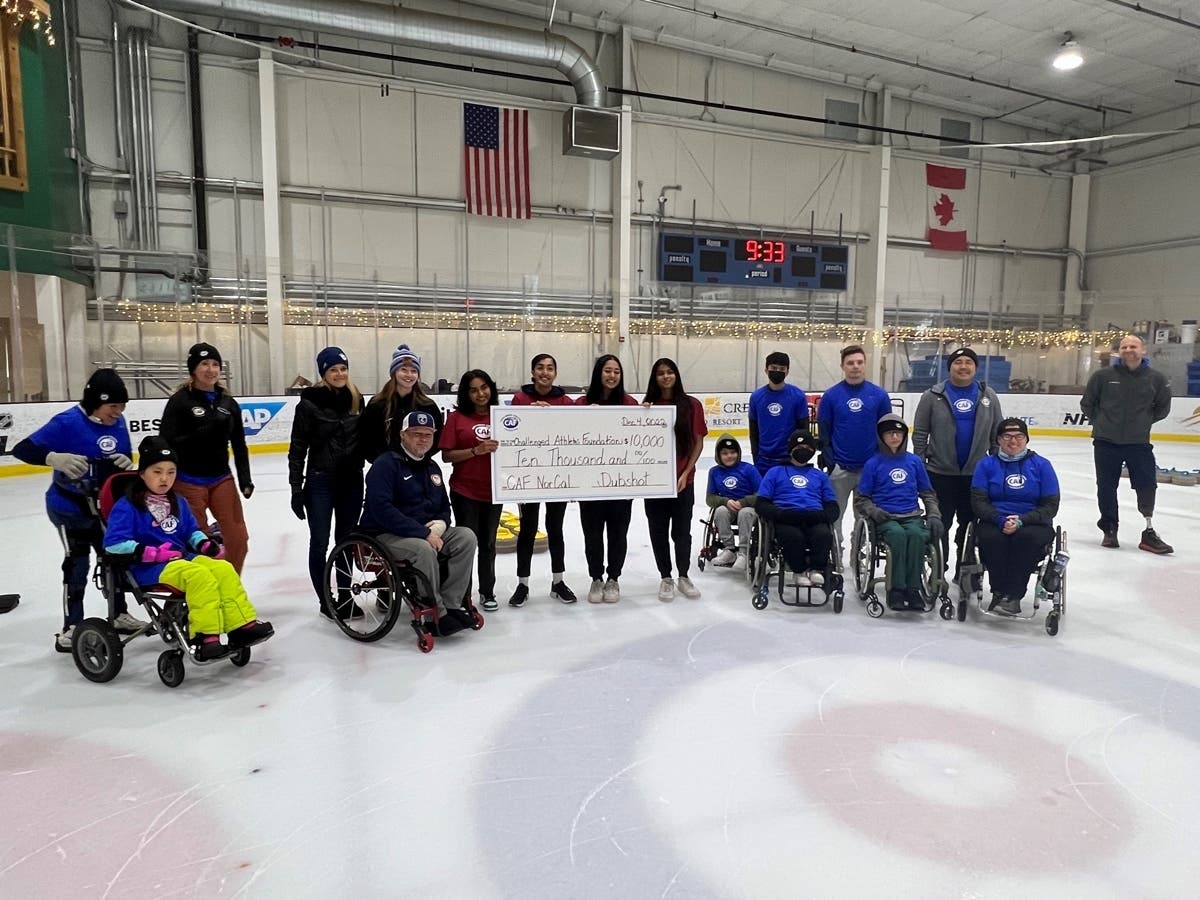 Anjana Kidambi, Aadya Tomar, Rhea John and Meghana Dwaram present $10,000 to the Challenged Athletes Foundation at Sharks Ice San Jose.