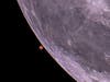 Mars right before disappearing behind the moon.