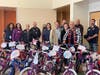 Rotarians, Fallon Middle School students, and Dublin officers worked together to build the bikes and watch the children receive them. 