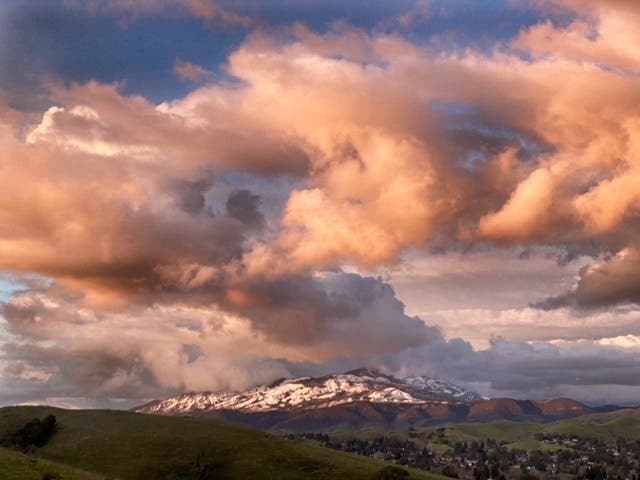 Cream-colored clouds float over a snow-capped Mt. Diablo in this enchanting photo by Rex Casey. 