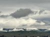 Both the sky and the mountain tops are bright white in this striking photo.