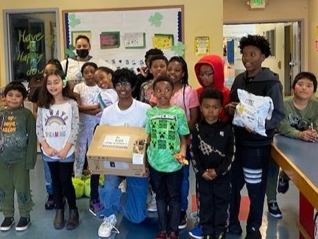 Sayam provides a projector to kids he tutors in Oakland.