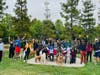 A large dog family group after their park cleanup.
