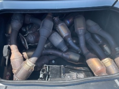 Officers say they found over 15 catalytic converters during a search of the car.
