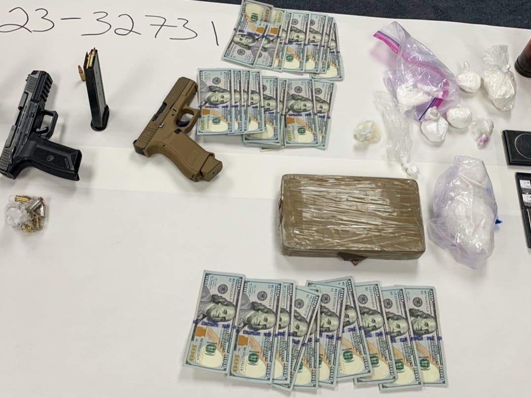 Pleasanton police and US Marshals uncovered two unregistered guns, over a kilogram of cocaine, and nearly $3000 in cash inside a Pleasanton home.
