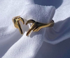 Arista Jewelry features hand-designed earrings, rings, and necklaces.