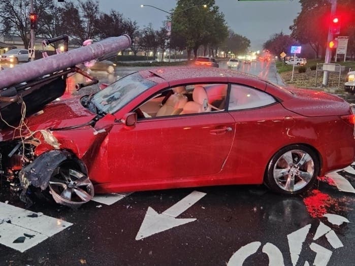 The car took out a signal pole at the northwest corner of Amador Valley Boulevard and San Ramon Road.