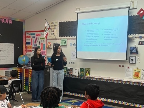 Anika Bhasin and Sumedha Chivukula give a presentation on advocacy at Coyote Creek Elementary School.