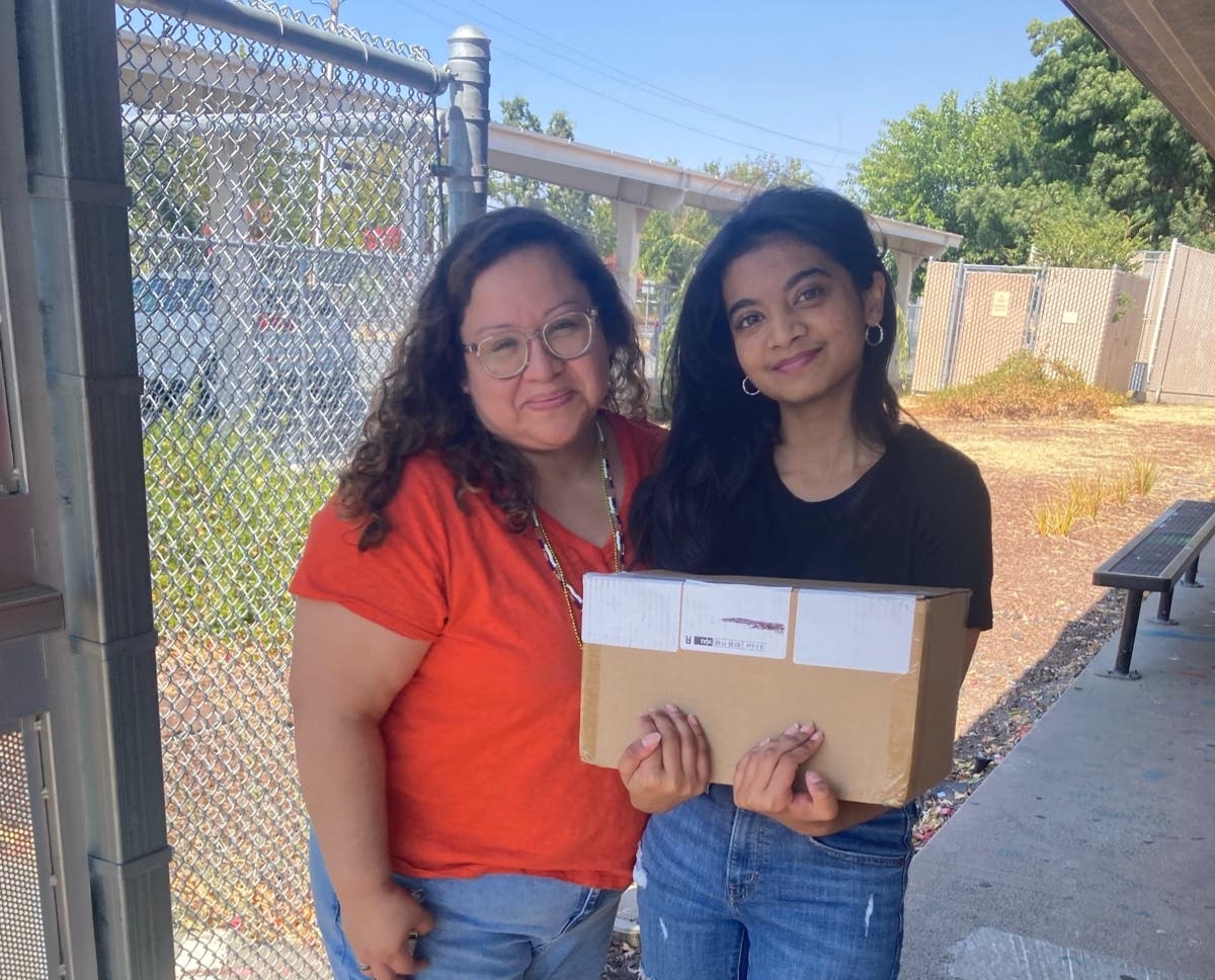 Srishti Mazumder donating supplies to Oak Grove Middle School in Concord. 