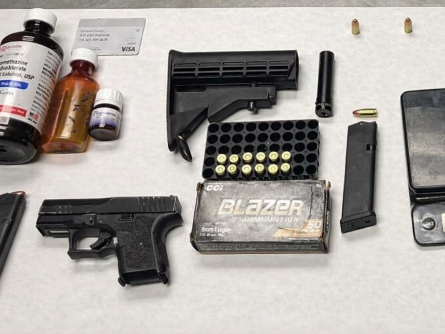 Police said that search warrants led to the recovery of illegal firearms, ammunition, narcotics for sale, and cash. 