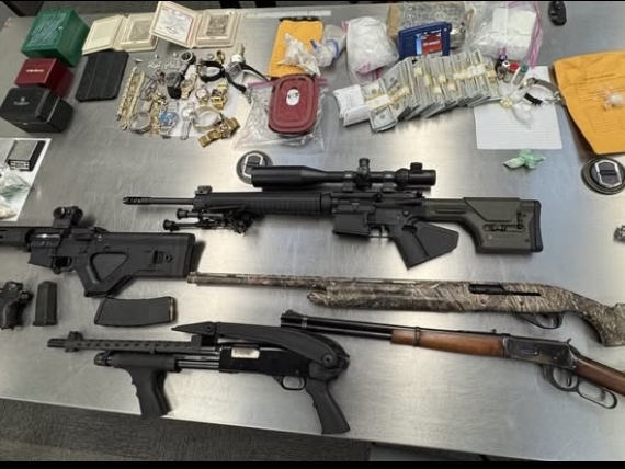 A Tri-Valley man was arrested after police say they found several pounds of drugs, eight firearms, and three luxury cars in his garage.