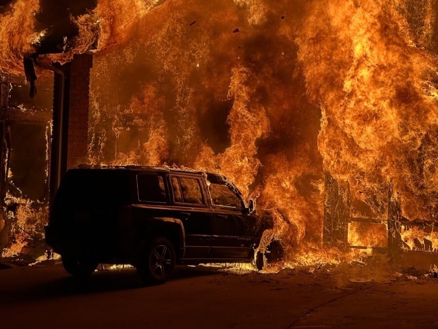 A barking dog alerted residents to an early morning garage fire that spread to the first floor and attic of their home.