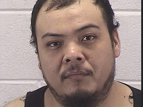 Jose A. Herrera, 30, of Aurora, is facing two felony charges after police allege he shot at a vehicle driving on his block. 
