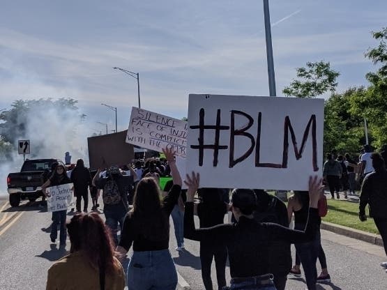Protesters demonstrate May 31 outside the Aurora Police Department. 