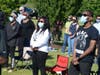 Worshippers join in a song Sunday at the outdoor service hosted by St. John AME Church.