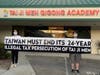 Tai Ji Men dizi hold a banner that reads, “TAIWAN MUST END ITS 24-YEAR ILLEGAL TAX PERSECUTION OF TAI JI MEN,” in front of the Tai Ji Men Qigong Academy in Cupertino, California on August 15, 2020.