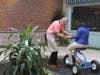 Jeffrey Slaff assists young bikers circling around LifeTown's shopping area!