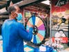 A guest spins the wheel for prizes during the Lou’s Jewelry & Pawn’s 100th anniversary celebration. The spinning wheel and a raffle for dining certificates at Steak 48 and Rittenhouse Grill raised money for Gift of Life Donors are Heroes Program.