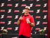 Duke Baxter, a former professional baseball player and owner of Zoned Sports Academy, addresses student-athletes and their guests at Zoned's annual "Signing Day" celebration.
