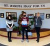 Luke Rost (7th Grade) pictured with Principal Bourrell and Marie Iannotta (3rd Grade Teacher)