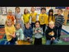 Students dressed in blue and yellow, which are the school colors of St. Francis Xavier Catholic School.  