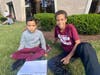 2nd grade student working with his 6th grade buddy.  