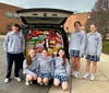 Student Council 8th grade students filled a van with cereal donations.  
