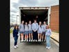 Dr. Alday-Engelman, SMS Student Council members, and Pam Bozzi,  along with All God's People representatives. 