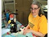 Deanna works a full-time job and makes masks when she comes home.
