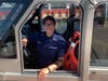 Machinery Technician Petty Officer 2nd Class Mallory Velez checks boat for any issues. (She took off her mask briefly for photo with photo standing six feet away.)